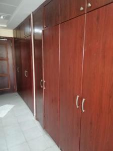 a row of wooden lockers in a room at The Gardens home in Dubai