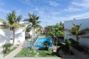an overhead view of a swimming pool with palm trees at Al Jar Resort - Families Only in Rayyis