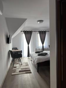 Postel nebo postele na pokoji v ubytování Casa Bocskai-Vendégház
