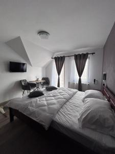 Postel nebo postele na pokoji v ubytování Casa Bocskai-Vendégház