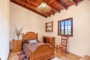 Postel nebo postele na pokoji v ubytování Retiro Canario