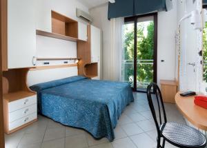 Postel nebo postele na pokoji v ubytování Hotel Trieste