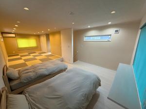 Katil atau katil-katil dalam bilik di 白浜温泉付き貸別荘c-23