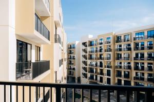 a view of some apartment buildings from a balcony at Fabulous Brand New 1BR, Gym Pool & Balcony in Ras al Khaimah