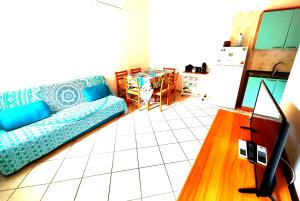 a living room with a couch and a table at Gamm Simius Home Holiday in Villasimius