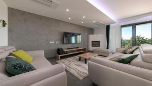 Et opholdsområde på Villa Althea by Villas Holiday