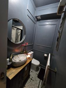 a bathroom with a sink and a mirror at 1 Minute to Everywhere! Galway City Centre in Galway