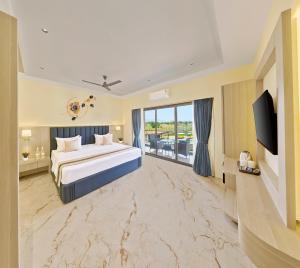 a bedroom with a large bed and a large window at Breeze By Patron Hotels in Igatpuri