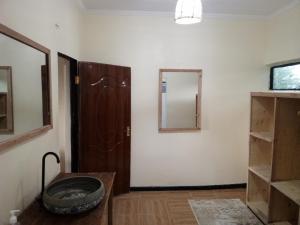 a room with a door and a mirror at Narasha homestay in Talek +27 photos