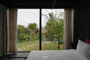 Postel nebo postele na pokoji v ubytování TOKI Ecolodge Cao Răm