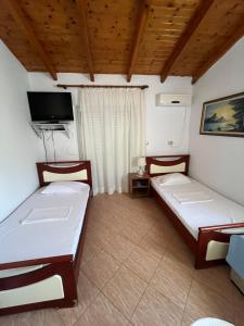 Postel nebo postele na pokoji v ubytování Hotel Portokali