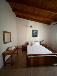Postel nebo postele na pokoji v ubytování Hotel Portokali
