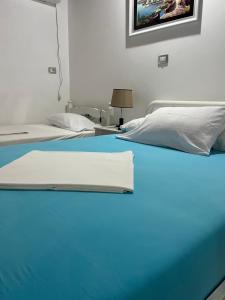 Postel nebo postele na pokoji v ubytování Hotel Portokali