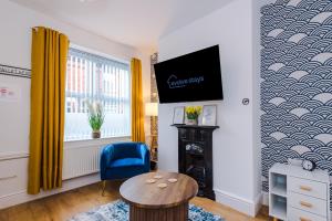 TV a/nebo společenská místnost v ubytování Beautiful 3Bed Home In Altrincham, Free Parking