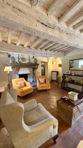 a large living room with two couches and a table at Casa di Pietro in Vivo d'Orcia, Pool in Vivo dʼOrcia