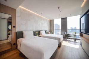 EVEN Hotel 上海金桥逸衡酒店客房内的一张或多张床位
