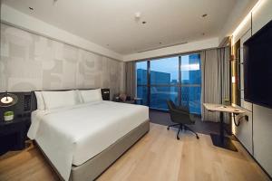 Postel nebo postele na pokoji v ubytování EVEN Hotel Shanghai Jinqiao by IHG + 37 fotografií
