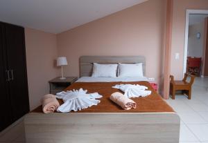Ένα ή περισσότερα κρεβάτια σε δωμάτιο στο Hotel Dionysos Polichrono