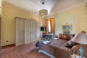 Letto o letti in una camera di Villa Vesuvio