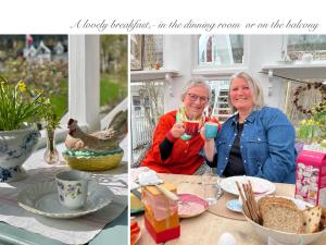 two women sitting at a table with a drink at Villa Solvorn in Solvorn