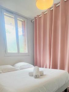 Giường trong phòng chung tại Ajaccio centre ville joli T2 Grandval +3 ảnh