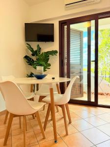 a dining room with a table and chairs at Marinaway - Appartamenti a 2 chilometri dal mare in Orosei