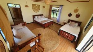 an aerial view of a bedroom with two beds at Narasha homestay in Talek