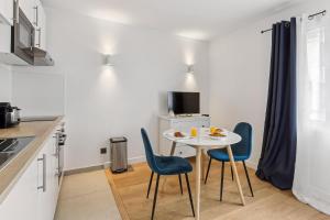Kuchyň nebo kuchyňský kout v ubytování Appartement charmant proche de la Défense + 6 fotografií
