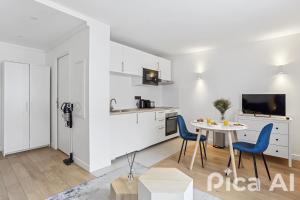 Kuchyň nebo kuchyňský kout v ubytování Appartement charmant proche de la Défense