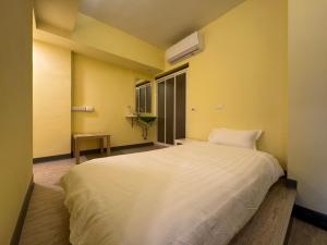 Postel nebo postele na pokoji v ubytování 慢且洄瀾文旅 Bantshiann Hualie Hotel