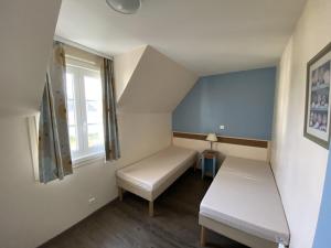 Postel nebo postele na pokoji v ubytování Belle Dune Quartier Les Eaux Vives