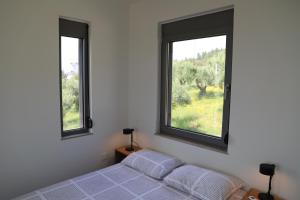 Postel nebo postele na pokoji v ubytování Enelia
