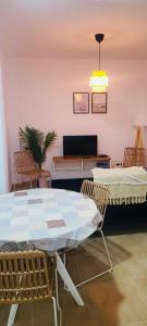 a room with a table and two chairs and a couch at Portonovo Residencial in Portonovo