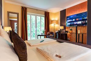 Vuode tai vuoteita majoituspaikassa Hotel Sonnenhof