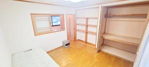 Postel nebo postele na pokoji v ubytování Guesthouse & Sharehouse カリマ安曇沓掛
