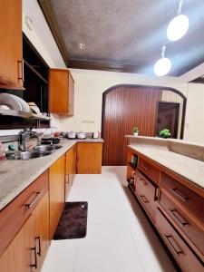 Kuchyň nebo kuchyňský kout v ubytování N6 Transient House Apartment Room near Abreeza Mall SPMC USEP SM Lanang