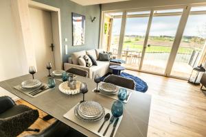 a living room with a table and a couch at Traumzeit Apartments in Dinkelsbühl