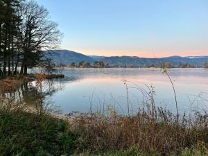 a large body of water with mountains in the background at U Hastrmana v pivovárku in Hroznětín +2 photos