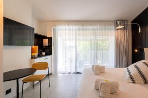 Postel nebo postele na pokoji v ubytování Doudou Hôtel