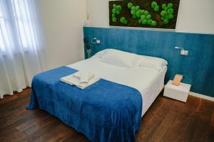 Postel nebo postele na pokoji v ubytování La Corte sul Naviglio
