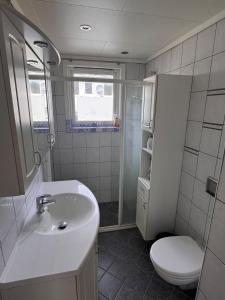 a bathroom with a sink and a toilet at Apart, 4 pers, Central in Odda in Odda
