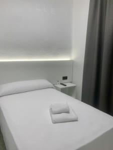 Postel nebo postele na pokoji v ubytování Hotel DL Urban