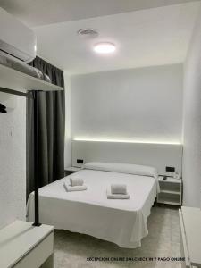 Postel nebo postele na pokoji v ubytování Hotel DL Urban