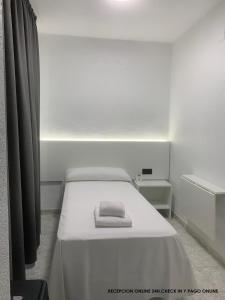 Postel nebo postele na pokoji v ubytování Hotel DL Urban