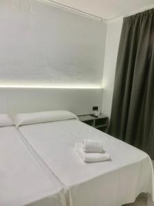 Postel nebo postele na pokoji v ubytování Hotel DL Urban