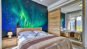 Кровать или кровати в номере Resort Sudety, Sun & Snow