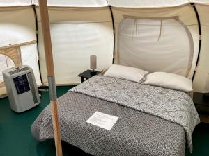 a bedroom with a bed in a tent at Fantastic Virginia Glamping Retreat near Charlottesville in Gordonsville