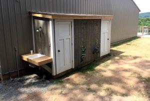 a bathroom with a sink next to a building at Gorgeous Virginia Retreat on a Farm with Spectacular Views in Gordonsville
