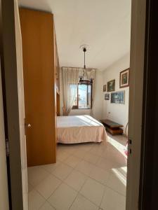 a bedroom with a bed and a window at Casa Vacanze Da Maria in Palinuro +13 photos