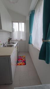 Kuchyň nebo kuchyňský kout v ubytování Apartments Gabriela